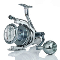 Fishing reel with '35KG MAX DRAG' text and a man holding a fish in the background.